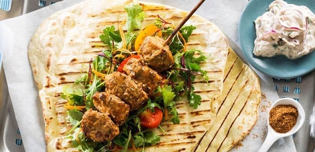 SPICY BBQ CHICKEN SKEWERS WITH RED ONION TZATZIKI AND POTATO FLAT BREAD