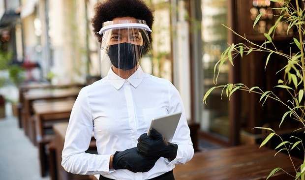 Waitress wearing protective gear.