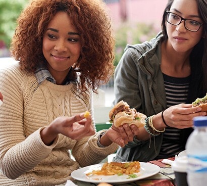 Different women eating.