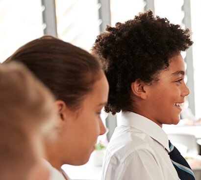 School kids smiling.