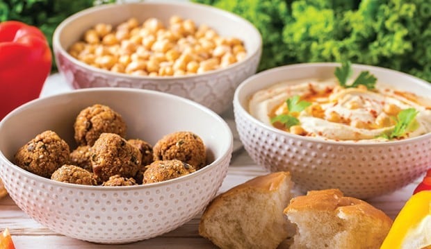 Bowls of chickpeas and falafels and hummus.