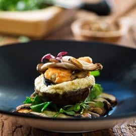 Baked Mushrooms Stuffed with Snails with Garlic Cream Cheese