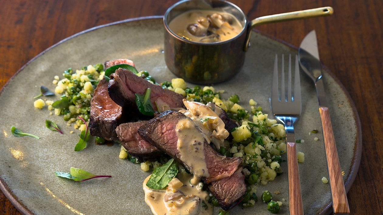 Rump Steak with Green Phutu Pap Served with Mustard and Mushroom Sauce