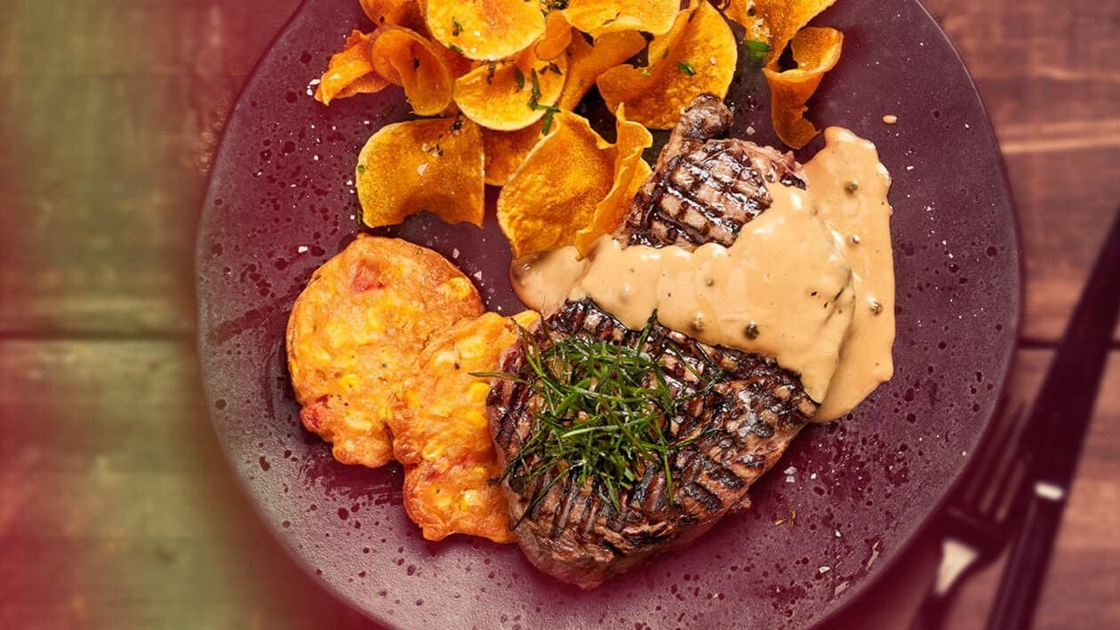 Grilled Steak with a Sweetcorn and Red Pepper Fritter Served with Crisp Butternut Shavings and Creamed Peppercorn Sauce – - Recipe